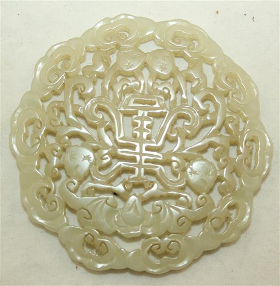 A Chinese celadon jade plaque, 19th century, 7.4cm